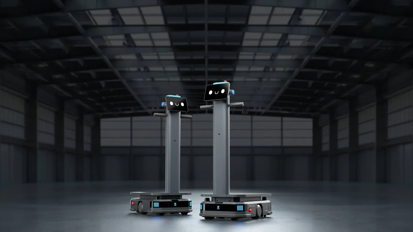 Hai robot vận chuyển tự hành Pudu T300 trong nhà xưởng